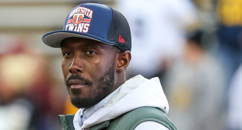 Kwesi Adofo-Mensah watches from the sideline at Huntington Bank Stadium.