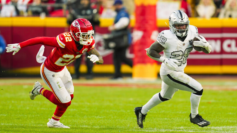 Sincere McCormick runs the ball against the Chiefs at Arrowhead Stadium.
