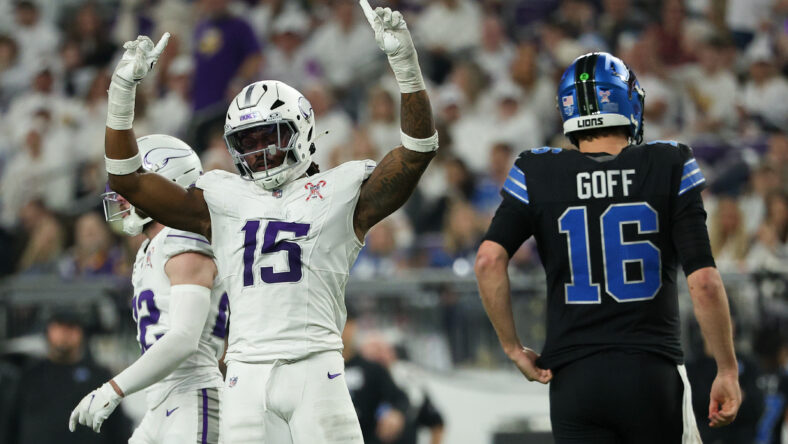 Vikings linebacker Dallas Turner celebrates as Lions quarterback Jared Goff reacts during second-half action.